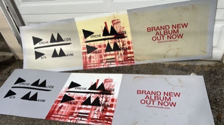 Ruined bus bench promotional signs, stained by roof water